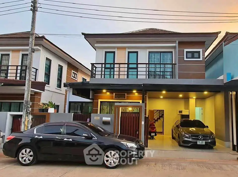 Modern two-story house with carport and stylish facade in suburban neighborhood.