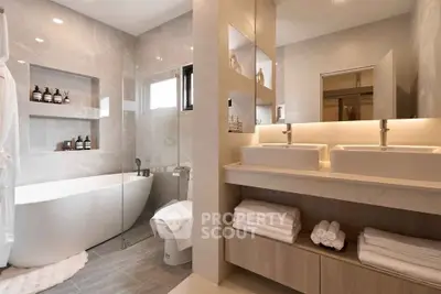 Luxurious modern bathroom with dual sinks and freestanding bathtub