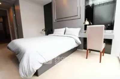 Modern bedroom with sleek design and comfortable bedding