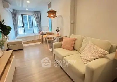 Cozy modern studio apartment with stylish decor and natural light