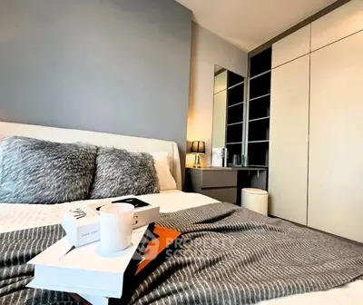 Modern bedroom with stylish decor and ample storage space