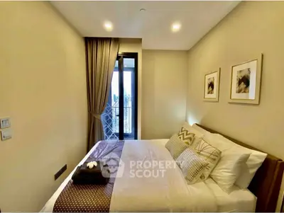 Cozy bedroom with elegant decor and balcony access in modern apartment