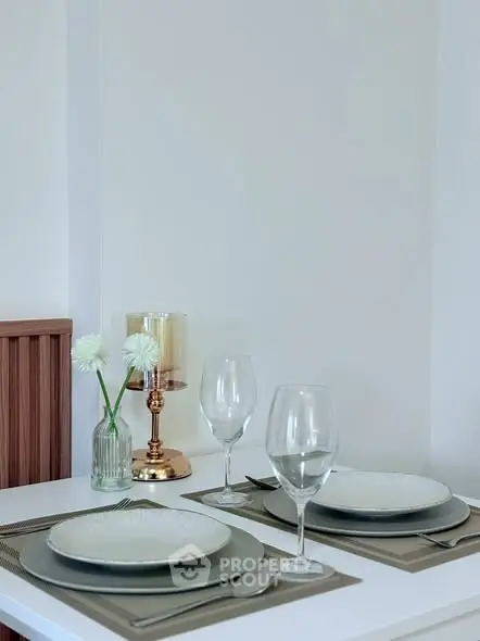 Elegant dining setup with modern decor and glassware