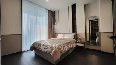 Luxurious modern bedroom with elegant decor and floor-to-ceiling windows