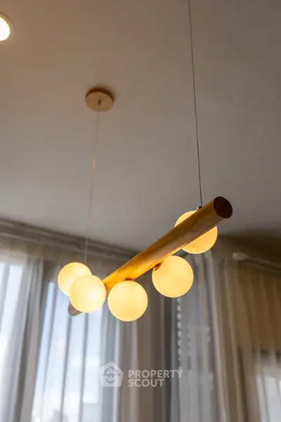 Modern interior lighting fixture with elegant design in a stylish living space.