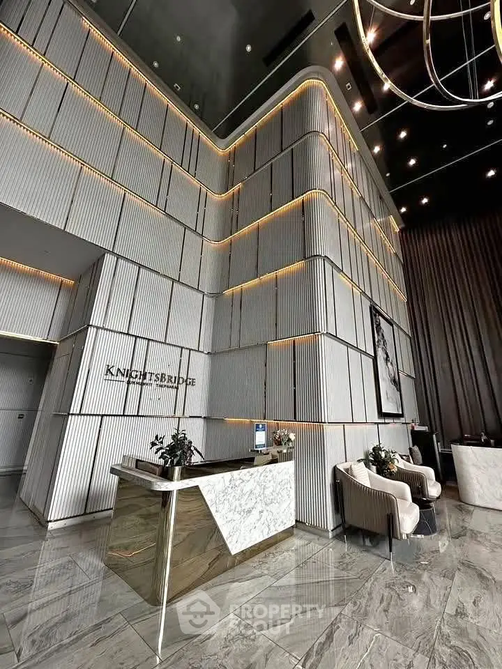 Luxurious modern building lobby with high ceilings and elegant decor