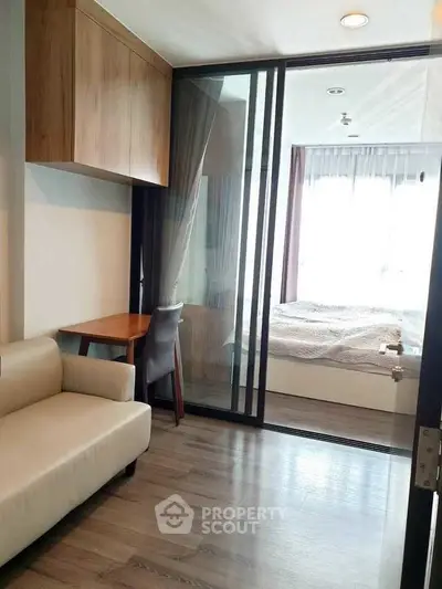 Modern apartment with sliding glass doors and cozy bedroom