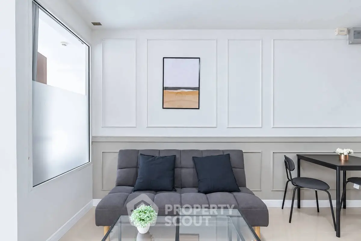 Modern living room with stylish sofa and minimalist decor
