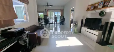 Spacious living room with modern decor and large windows offering natural light.