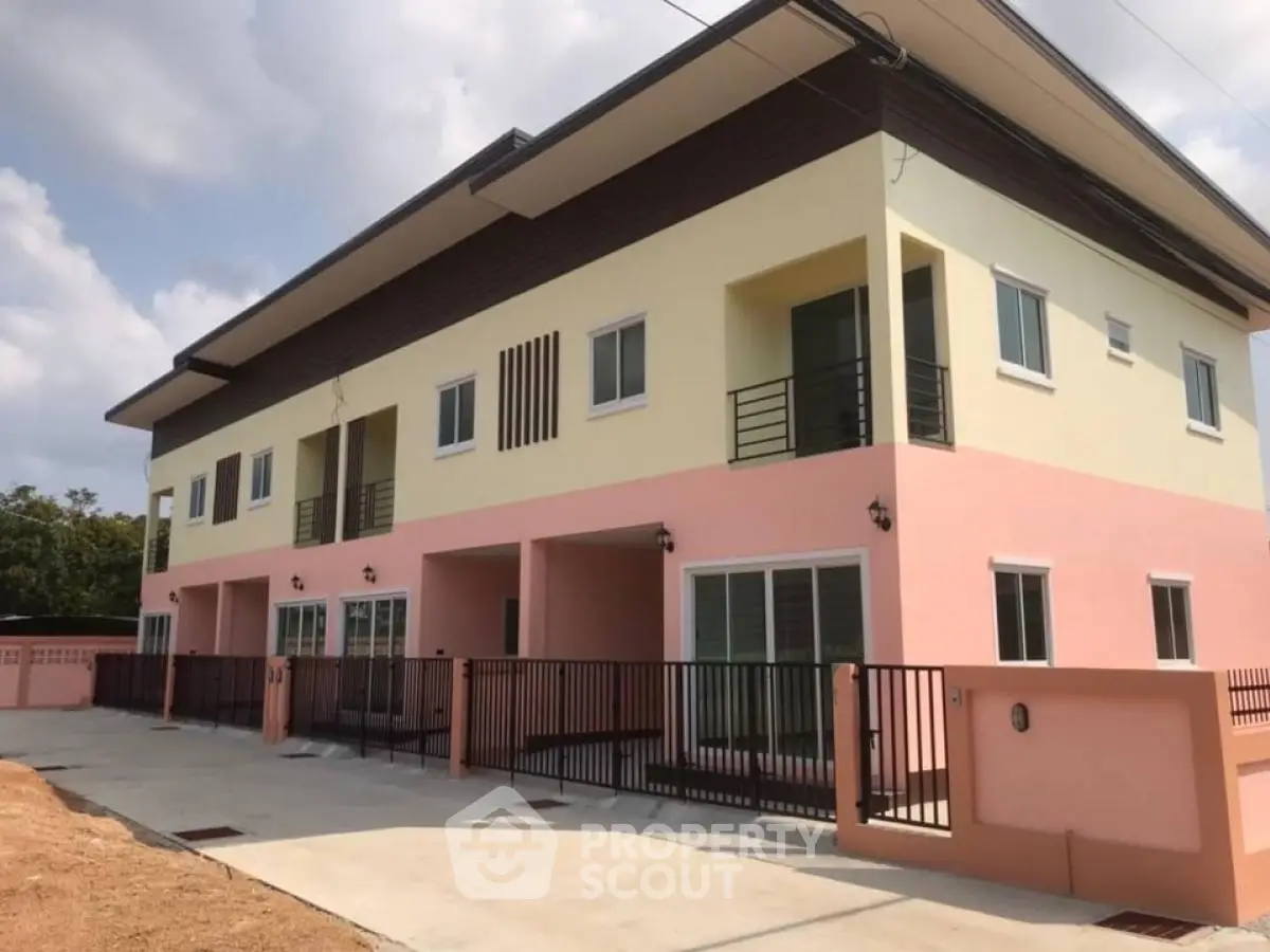 Modern duplex building with spacious balconies and contemporary design