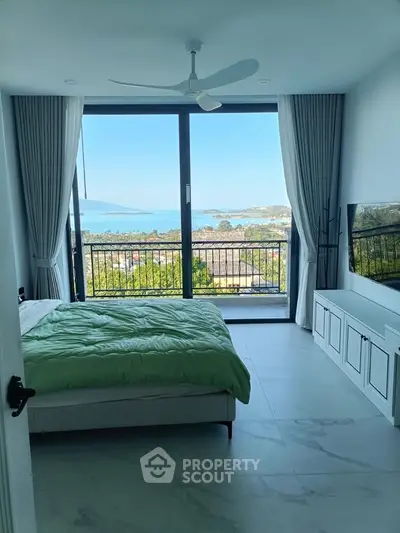 Luxurious bedroom with stunning ocean view and modern decor