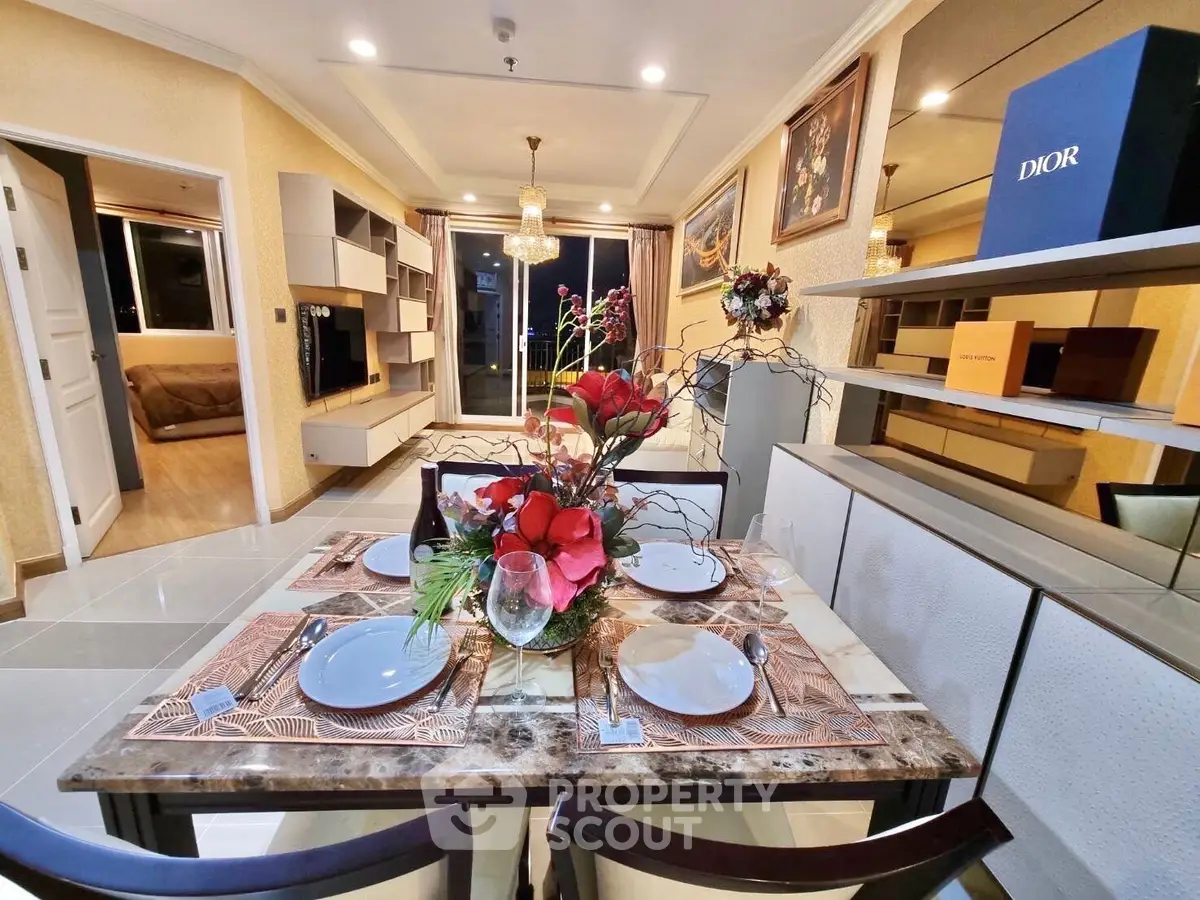 Luxurious dining area with elegant decor and open living room view