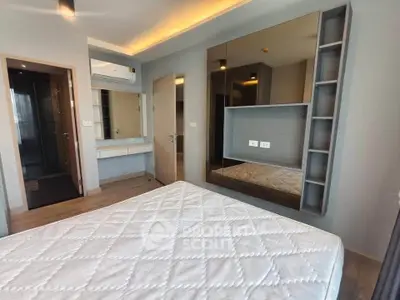 Modern bedroom with stylish built-in storage and ambient lighting, featuring a comfortable mattress and sleek design.