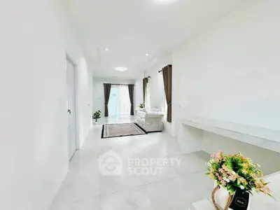 Bright and spacious living room with elegant decor and large windows for natural light.
