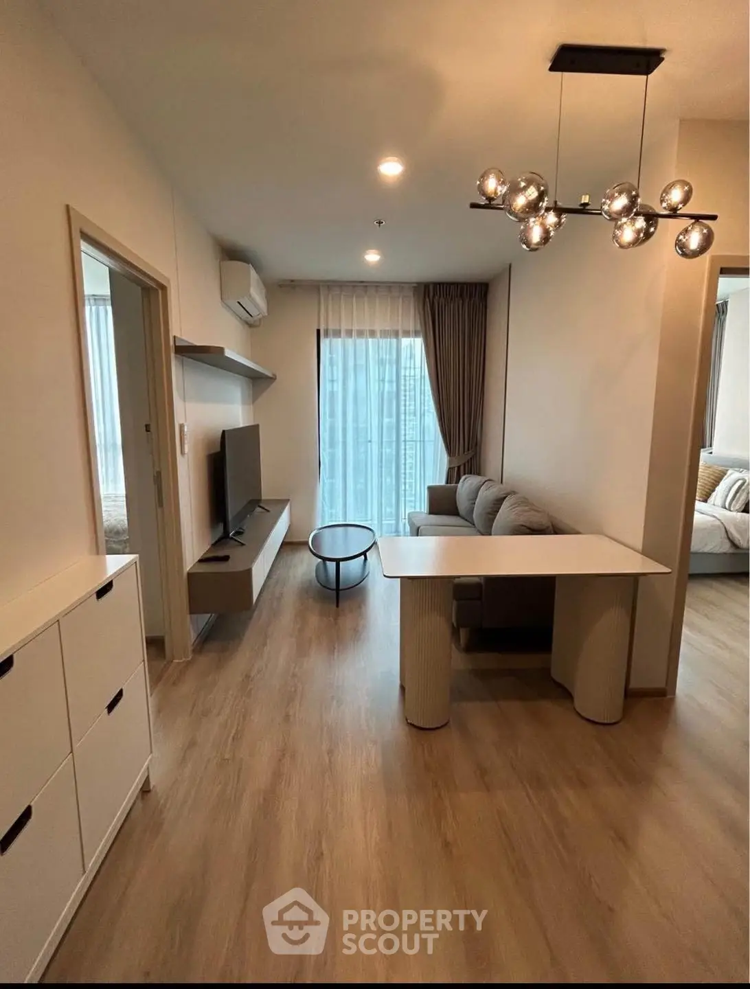 Modern living room with stylish lighting and cozy seating area