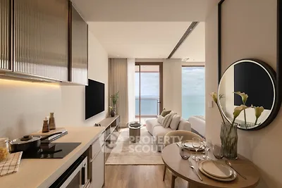 Luxurious open-plan kitchen and living room with stunning ocean view, modern decor, and elegant furnishings.