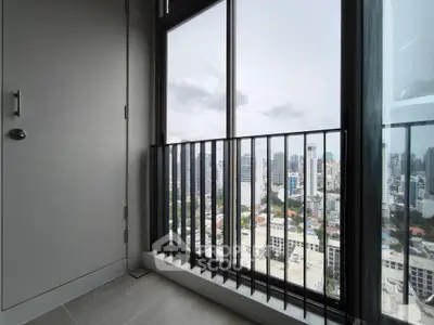 Stunning cityscape view from a modern high-rise balcony with sleek railing design.