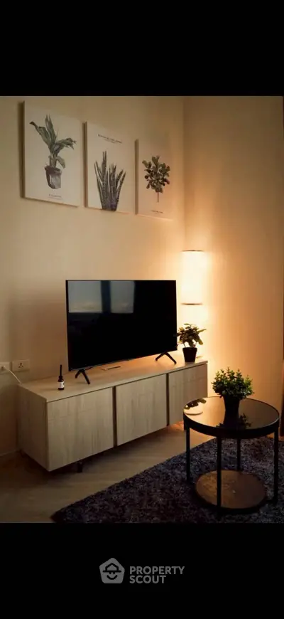 Cozy living room with modern TV setup and stylish decor