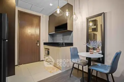 Modern compact kitchen with dining area in stylish apartment