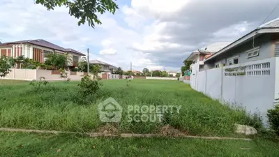 Spacious residential plot surrounded by modern homes, ideal for building your dream house in a serene neighborhood.