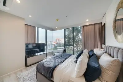 Luxurious bedroom with panoramic city view and modern decor
