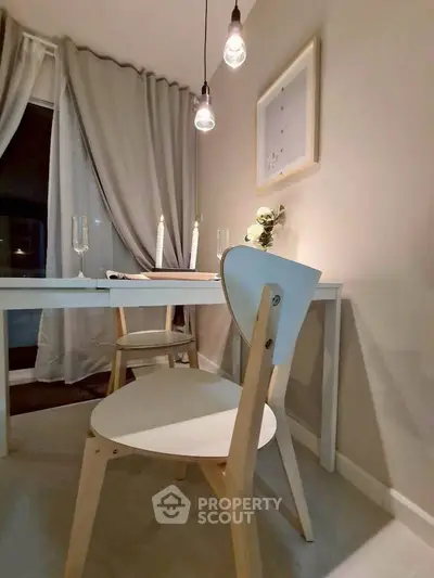 Cozy dining nook with elegant lighting and minimalist decor