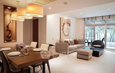 Elegant living and dining area with modern decor and natural light