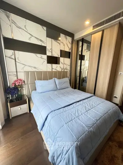Luxurious bedroom with elegant decor and modern furnishings, featuring a comfortable bed and stylish wardrobe.