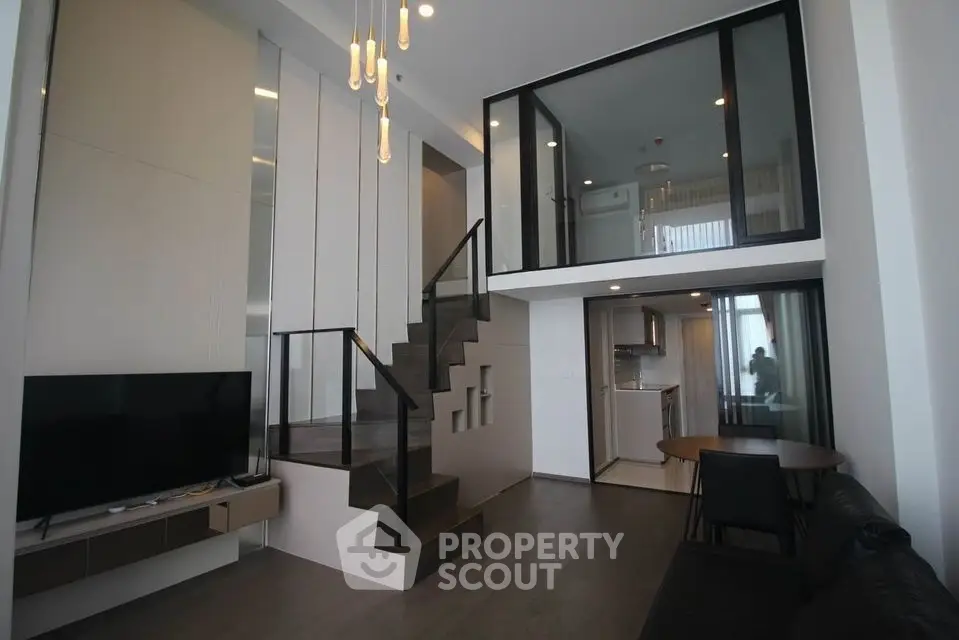 Modern duplex apartment with sleek design and open kitchen layout