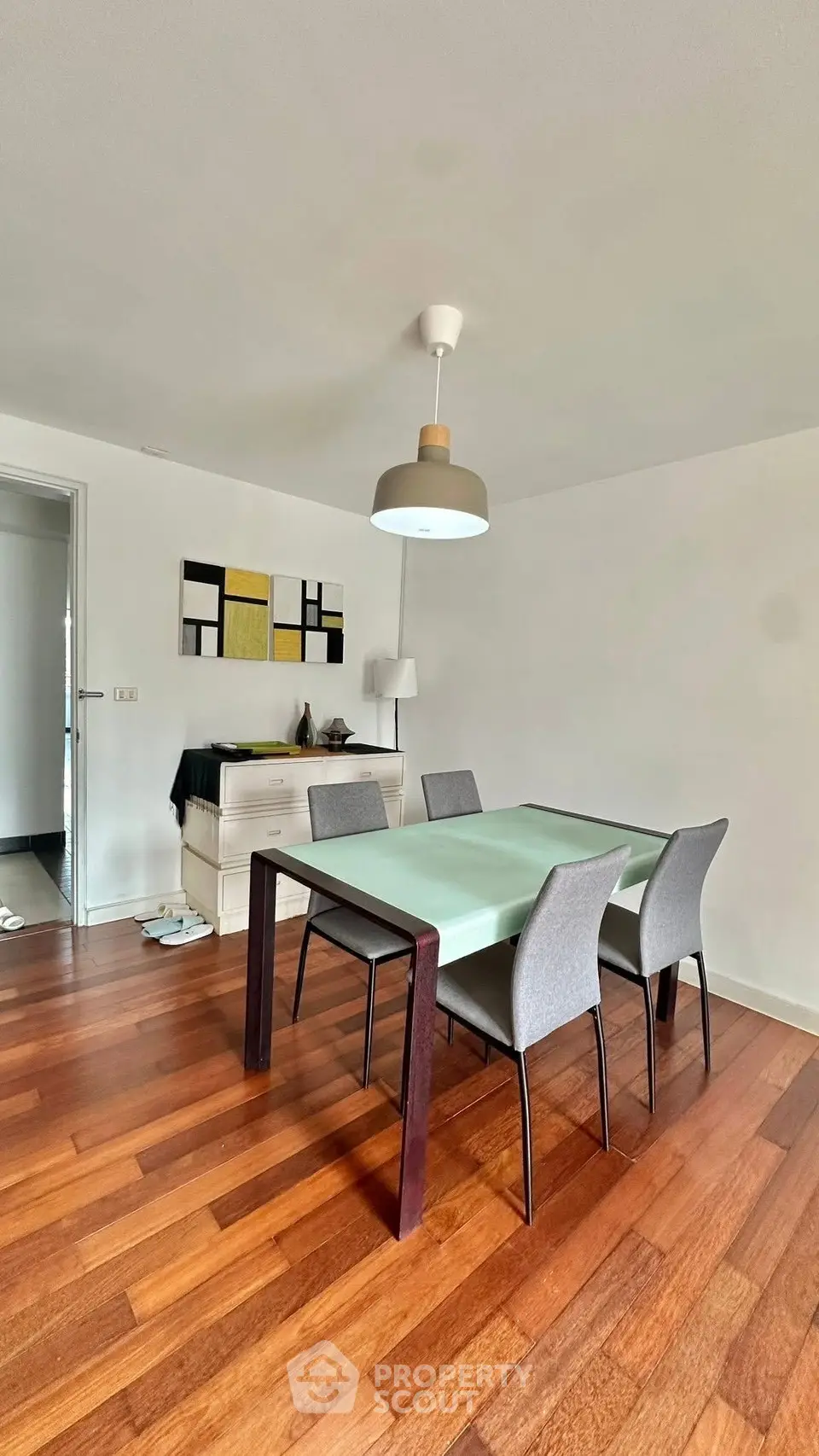 Modern dining area with wooden flooring and stylish furniture
