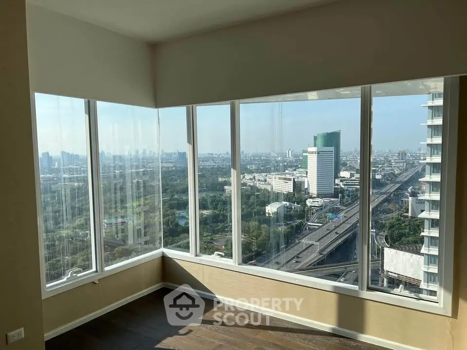 Stunning corner unit with panoramic city views and floor-to-ceiling windows.