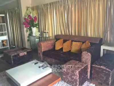 Luxurious living room with plush velvet sofa, elegant curtains, and modern coffee table.
