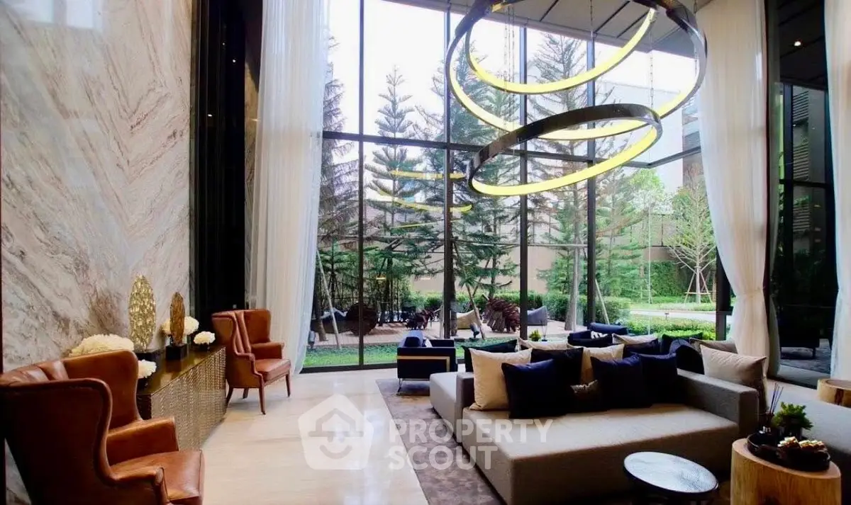 Luxurious modern living room with floor-to-ceiling windows and elegant decor overlooking a lush garden.