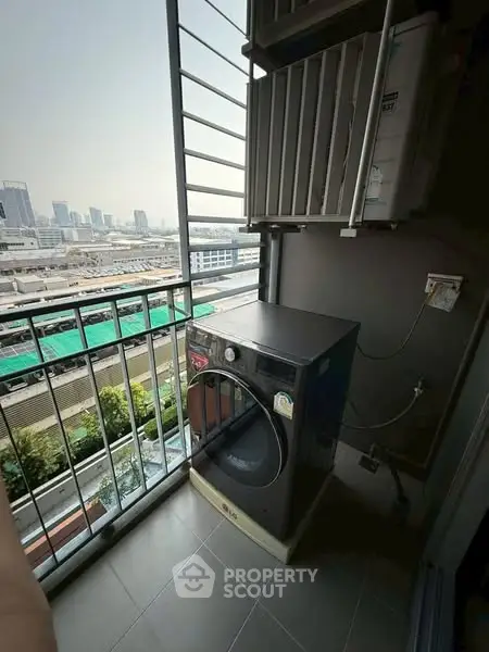 Urban balcony with washing machine and city view, ideal for modern living.