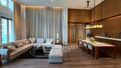 Luxurious modern living room with elegant dining area, high ceilings, and stylish decor.