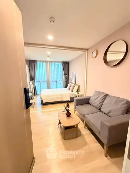 Modern studio apartment with cozy living area and stylish decor