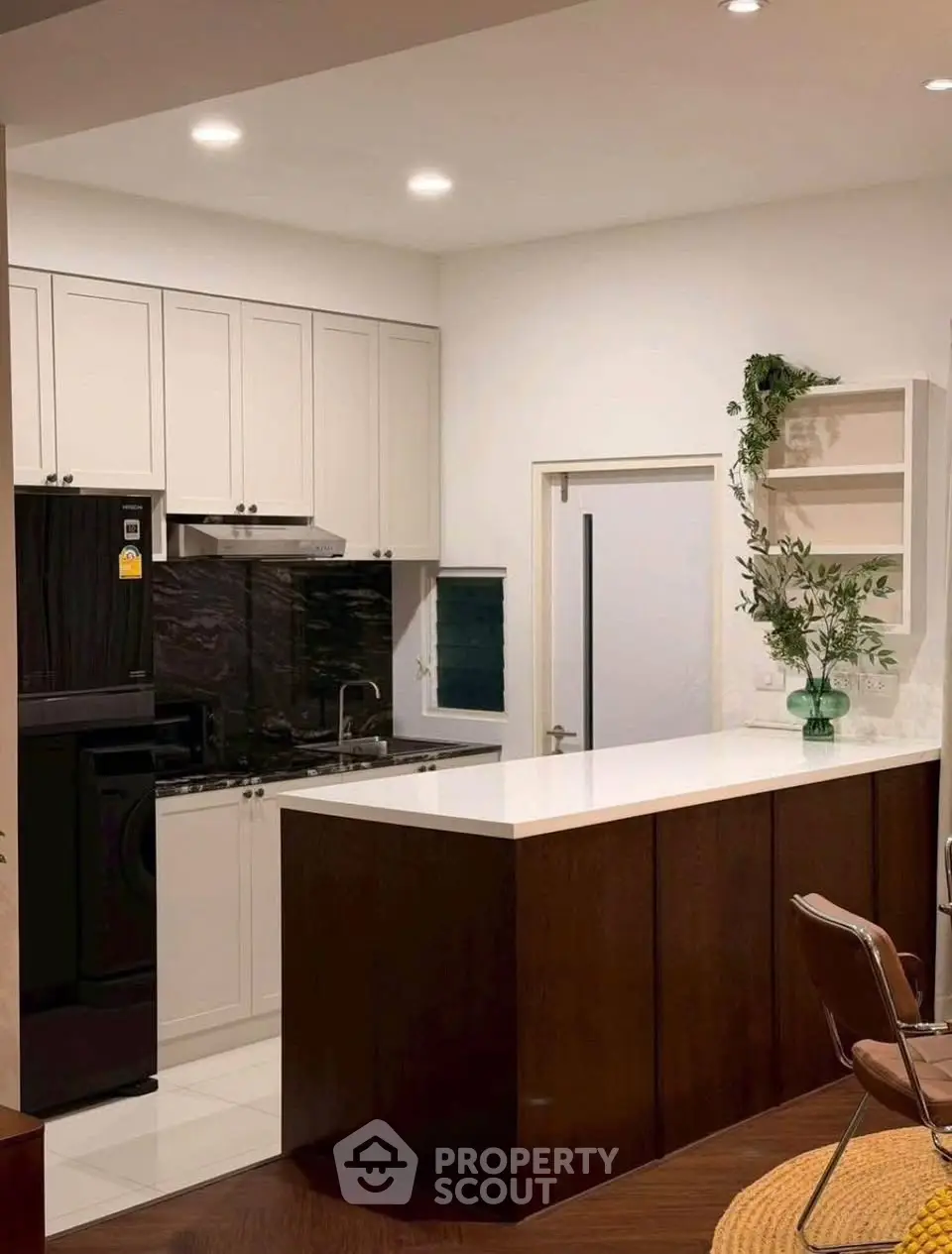 Modern kitchen with sleek cabinetry and integrated appliances