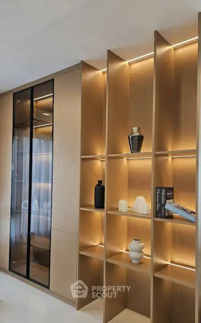 Elegant modern living room with stylish wooden shelving and ambient lighting
