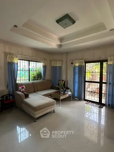 Spacious living room with elegant decor and natural light