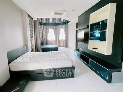 Spacious modern bedroom with sleek design and natural light