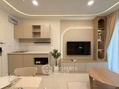 Modern open-plan living room with integrated kitchen and stylish decor