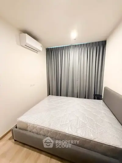 Modern bedroom with minimalist design and air conditioning