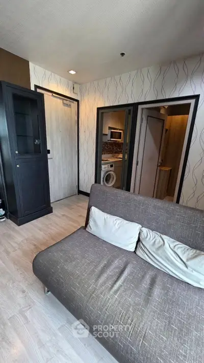 Modern living room with stylish sofa and sleek storage cabinet