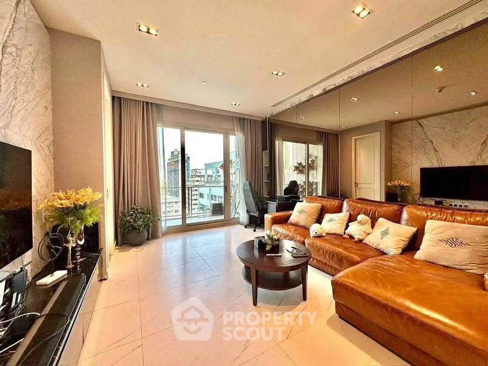 Luxurious living room with leather sofa and city view balcony, perfect for modern urban living.