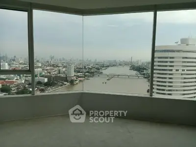 Stunning river and cityscape view from high-rise apartment corner unit.
