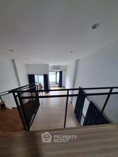 Spacious modern loft with high ceilings and large windows, perfect for urban living.