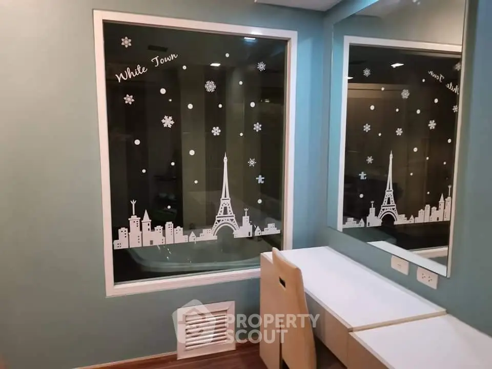 Chic study nook with Eiffel Tower window decal in modern apartment