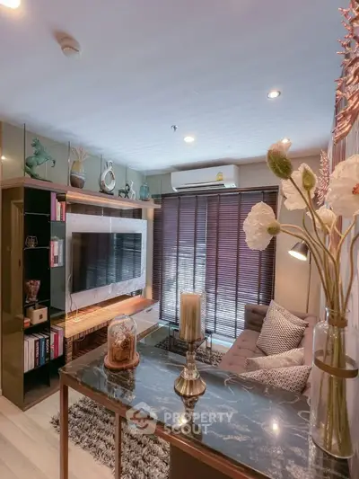 Stylish living room with modern decor, cozy seating, and elegant lighting in a chic apartment.