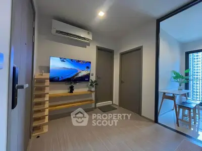 Modern living room with sleek design and balcony view in urban apartment