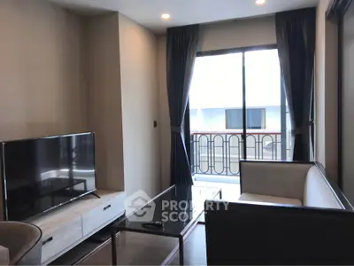 Modern living room with sleek furniture and balcony view in a stylish apartment.